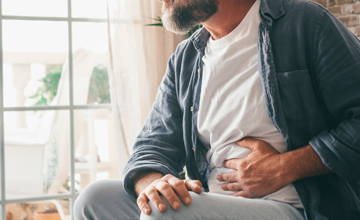 a man touching his stomach